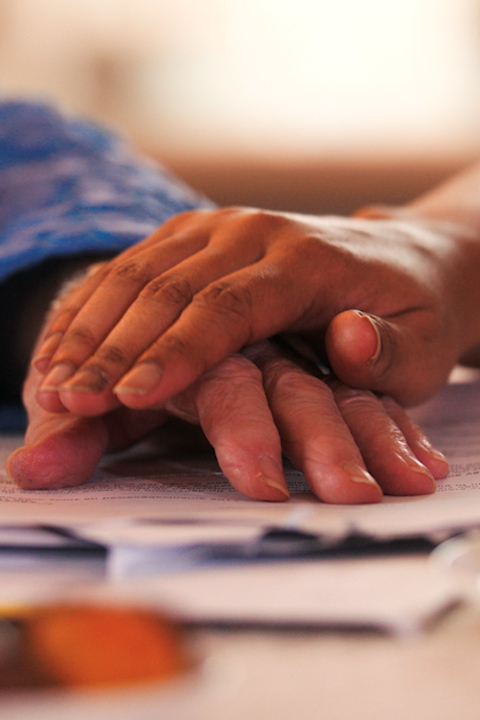 carer holding the client's hands